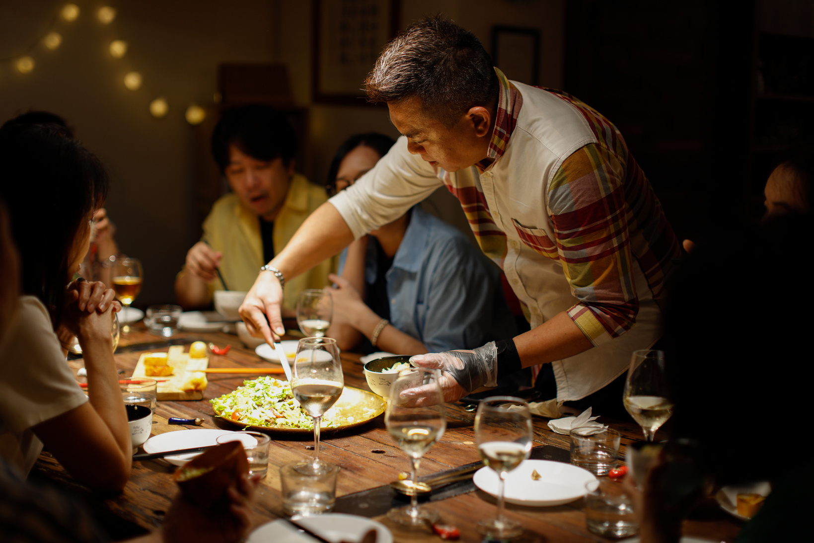 Private kitchen chef busy serving guests