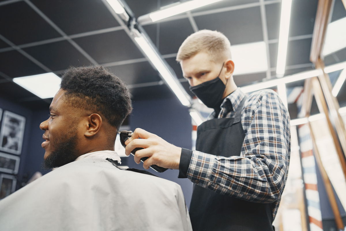 Man Getting His Hair Cut in a Barber Shop 